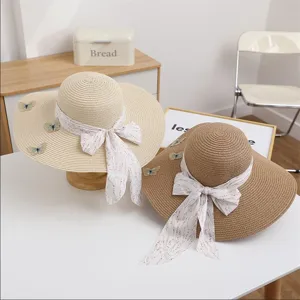 Women summer wide brim straw hat with ribbon bow and butterfly decor beach sun hat vacation