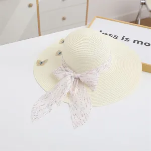 Women summer straw hat with wide brim, delicate butterfly embroidery and floral ribbon bow.