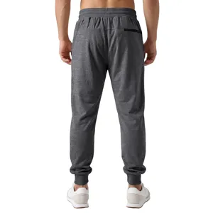 Pantalon de jogging en molleton pour homme, pantalon gris foncé avec poche arrière zippée.