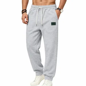 Heren fleece gevoerde losse casual joggingbroek met trekkoord en uniek patchdetail.