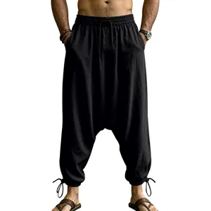 Men's black linen harem pants, casual drop-crotch streetwear trousers with drawstring waist.