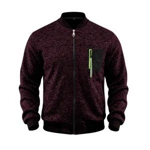 Close-up detail of the men's knit bomber jacket with contrast zipper chest pocket and ribbed hem.