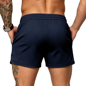 Back view detail of men's athletic quick-dry shorts in deep blue, breathable mesh fabric.