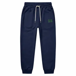 Heren gevoerde winter joggingbroek casual losse sweatbroek met trekkoord en logo patch detail.
