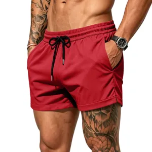 Close-up detail of red men athletic mesh shorts with black drawstring and side pockets.