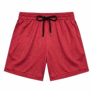 Red men's athletic shorts with black drawstring, breathable quick-dry fabric for summer beach.