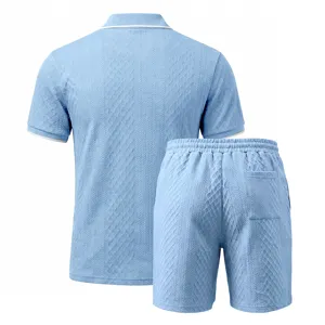 Close-up view of the light blue textured jacquard knit fabric and back collar detail.