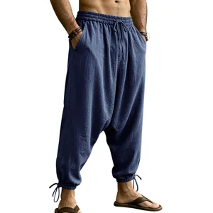 Men's casual linen harem pants detail showing elastic drawstring waist and ankle tie cuffs.
