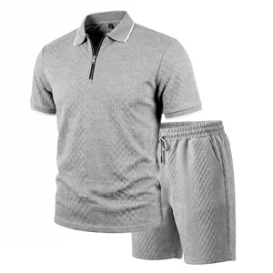 Detailed view of the gray textured short-sleeve polo shirt and shorts set with zipper.