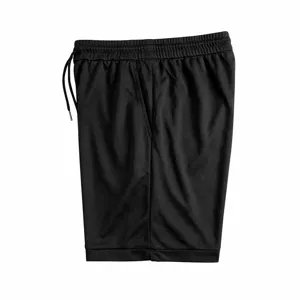Close-up detail of black athletic shorts, featuring elastic drawstring waist and breathable fabric.