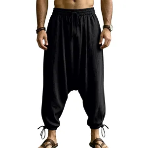 Men's casual linen harem pants loose drop crotch trousers with drawstring and ankle ties.