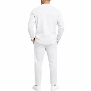 Detailed back view of men's solid white casual long sleeve henley shirt and trouser set.