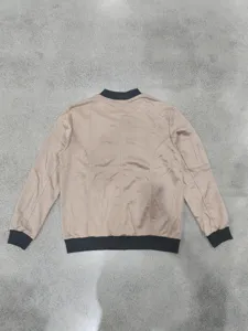 Rear view detail of men's casual suede bomber jacket with black ribbed collar and cuffs.