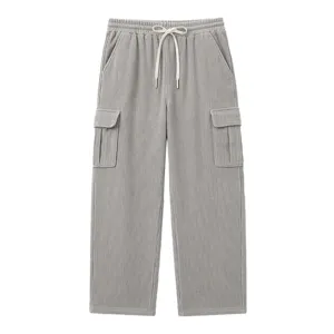 Grey corduroy cargo pants detail, elastic drawstring waist and multi-pocket straight cut.