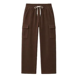 Detailed view of brown corduroy cargo pants texture, drawstring waist and side utility pockets.