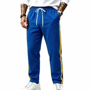 Detail view of men casual colorblock sweatpants with side stripes and drawstring waist.