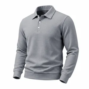 Close-up detail of the grey men's waffle knit long sleeve polo shirt texture and collar design.