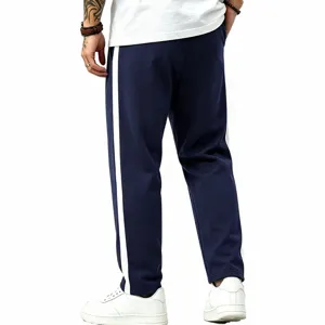 Men casual loose sweatpants detail view, dark blue with white side stripe, straight fit.