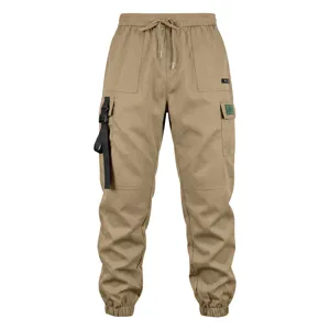 Khaki cargo pants detail featuring multi-pockets, adjustable drawstring waist and cuffed hem.