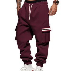 Detailed view of men's thick fleece-lined cargo sweatpants in maroon with drawstrings.