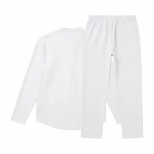 Detailed view of the white long-sleeve henley shirt and matching straight trousers set.