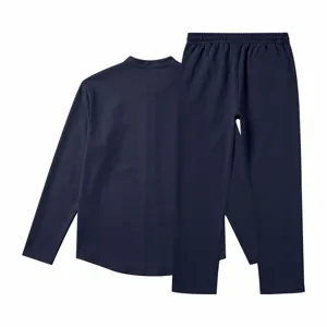 Men's navy blue long sleeve henley shirt and straight trousers detail showcase view.