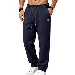 Textured mens casual sweatpants with elastic drawstring waist and relaxed fit for daily wear.