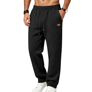 Men's loose casual fleece sweatpants with textured heavy fabric, elastic drawstring waist and pockets.