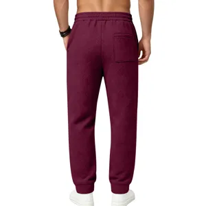Back view detail of men's heavy textured casual sweatpants with loose fit and back pocket.
