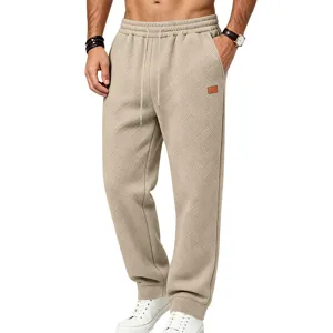 Detailed view of men's casual textured sweatpants fabric, khaki track pants close up shot