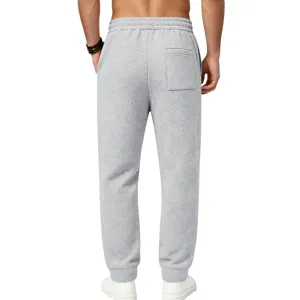 Detailed view of the textured grey mens sweatpants back pocket and elastic waistband design.