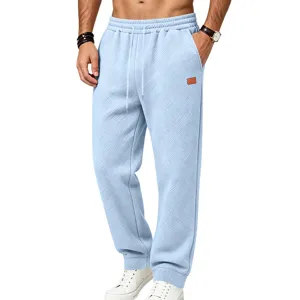 Men's light blue textured casual sweatpants with comfortable loose fit and drawstring.