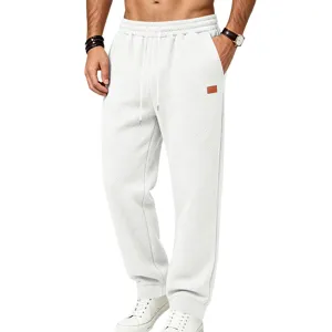 Men's white casual textured sweatpants, loose fit athletic joggers with elastic drawstring waist.