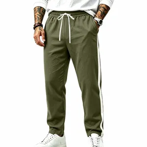 Men's green casual sweatpants with white side stripes and drawstring waist, loose fit.