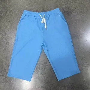 Detailed view of blue knit texture casual men's seven-point shorts with drawstring waist.