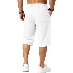 Detail view of men's white casual textured linen-feel knee length shorts with back pocket.
