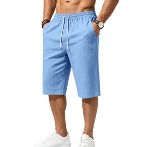 Men's light blue casual drawstring cropped shorts with textured linen-look fabric for summer.