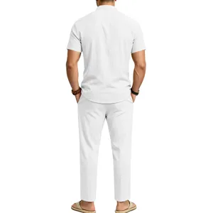 Back view of men's casual white linen short sleeve shirt and trousers fit detail.