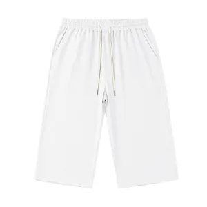 White waffle knit texture mens casual shorts detail, elastic drawstring waist fabric close up view.