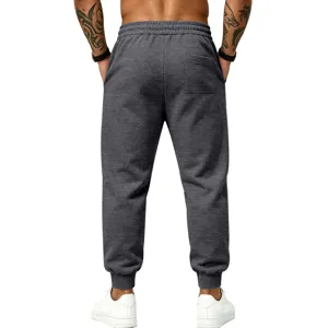 Dark grey fleece lined sweatpants back detail, elastic cuffs and back pocket design.