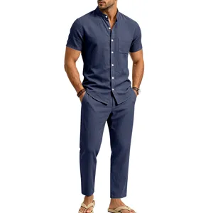 Detail view of the dark blue linen short sleeve shirt and trousers set with button details.