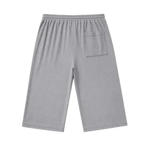 Detailed view of gray men's casual linen-texture shorts, back pocket and elastic waist.
