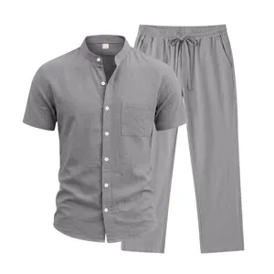 Close-up detail of men casual linen short sleeve shirt and trousers set in gray color.