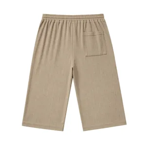 Men casual khaki knee-length shorts with textured knit fabric, elastic waist and back pocket.