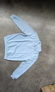 Heren casual lichtblauwe lang mouwen half zip polo sweatshirt met getextureerd gebreid.