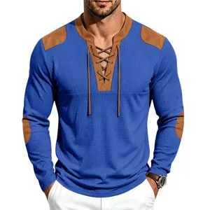 Men's waffle knit long sleeve Henley shirt with vintage contrast patches and lace up detail.