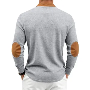 Back view detail of mens waffle knit long sleeve shirt with brown elbow patches and collar.