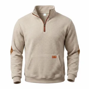 Men's waffle knit half-zip sweatshirt with contrast elbow patches and front pocket.