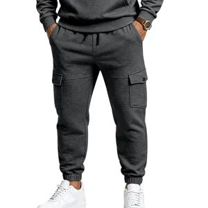 Dark grey fleece cargo sweatpants detail, featuring multi pockets and cozy ribbed cuffs.