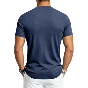 Men's blue short sleeve crewneck t-shirt back view closeup showcasing fit and fabric texture.
